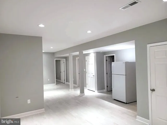 a view of a livingroom with a refrigerator
