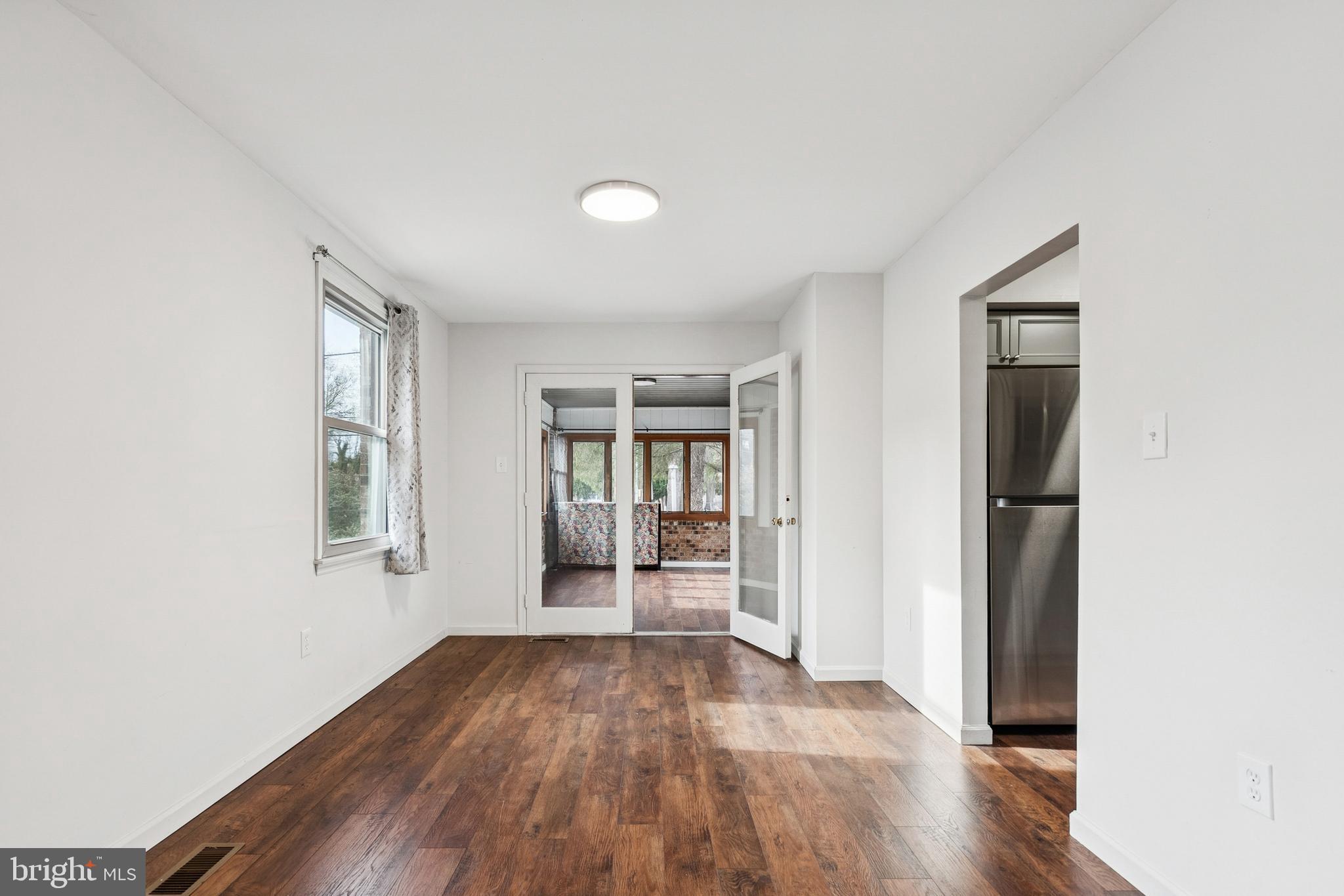 715 Cooper Landing Road Cherry Hill, NJ 08002 - Photo 12 of 23 an empty room with wooden floor and windows