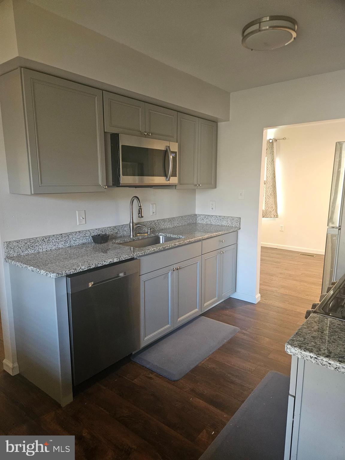 715 Cooper Landing Road Cherry Hill, NJ 08002 - Photo 3 of 23 a kitchen with stainless steel appliances granite countertop a sink and a microwave
