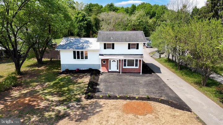 1528 Matthewstown Road Hanover, MD 21076 - Photo 1 of 15 Charming home with lush greenery backdrop.