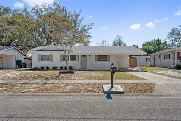 a house with yard in front of it