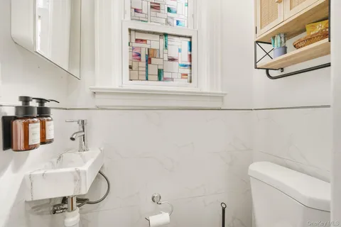 a bathroom with a sink and toilet