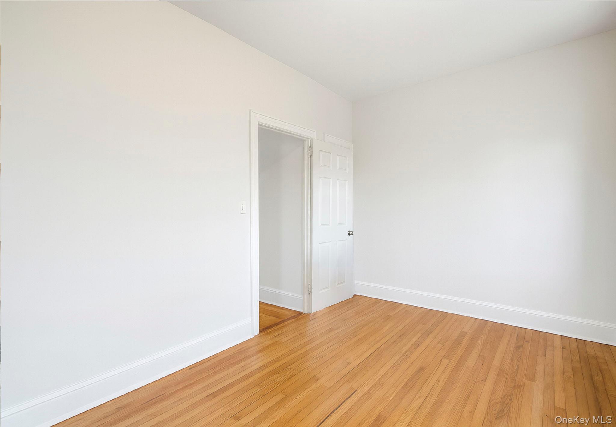 4331 Bruner Avenue Bronx, NY 10466 - Photo 24 of 40 a view of an empty room with wooden floor