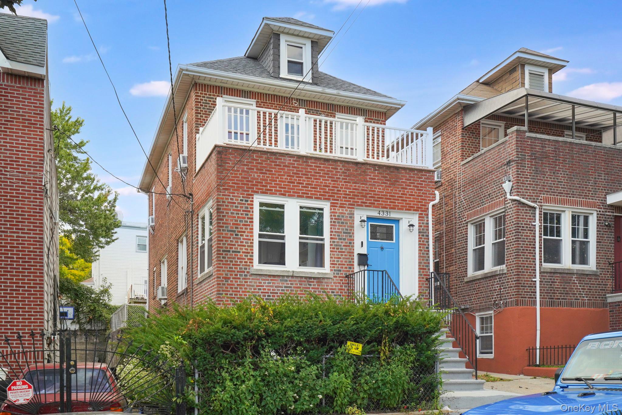 4331 Bruner Avenue Bronx, NY 10466 - Photo 34 of 40 a front view of a house with a yard