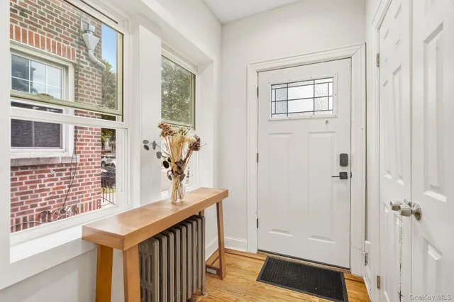 a view of a entryway door with wooden floor