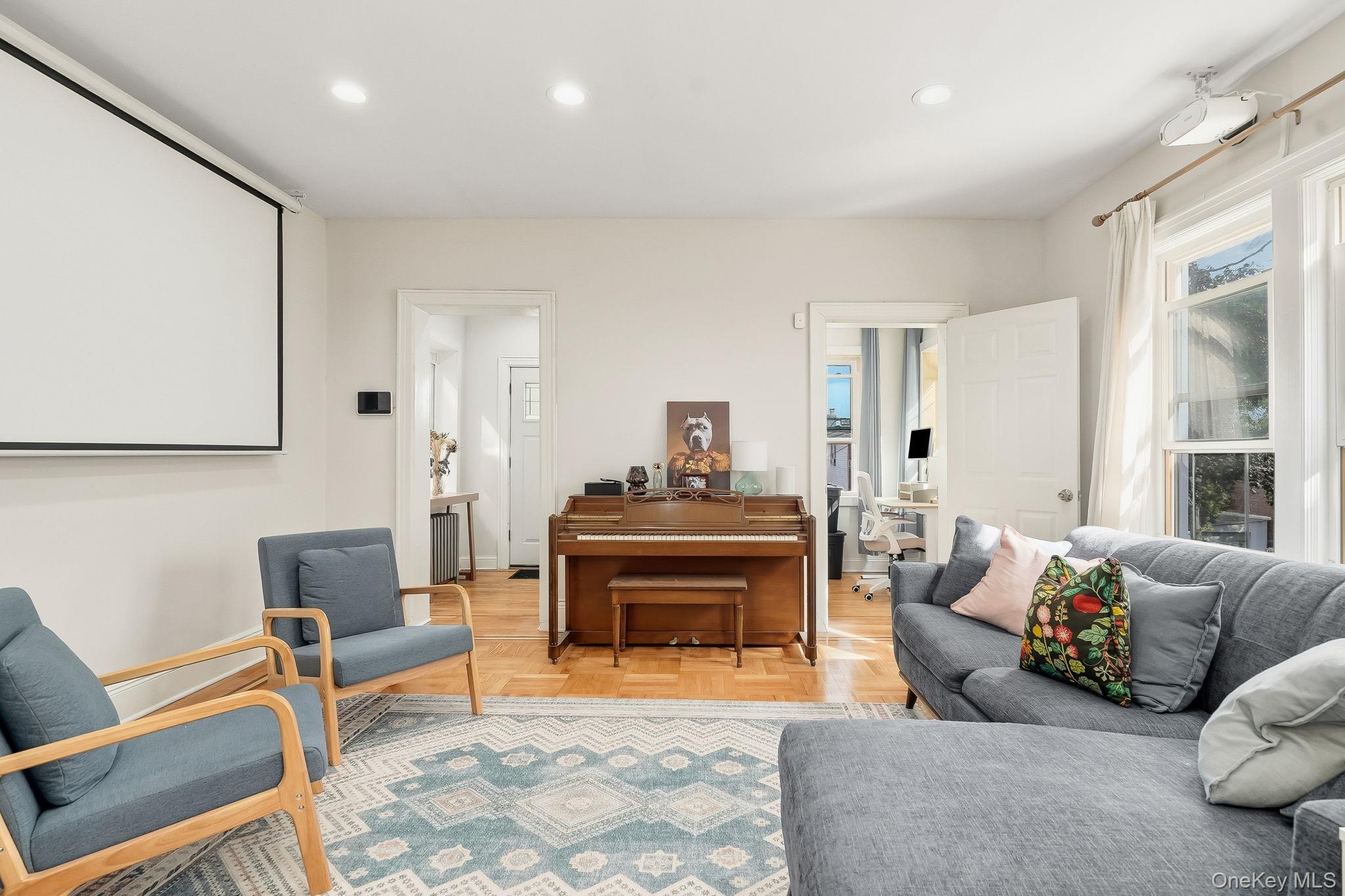 4331 Bruner Avenue Bronx, NY 10466 - Photo 6 of 40 a living room with furniture and a fireplace