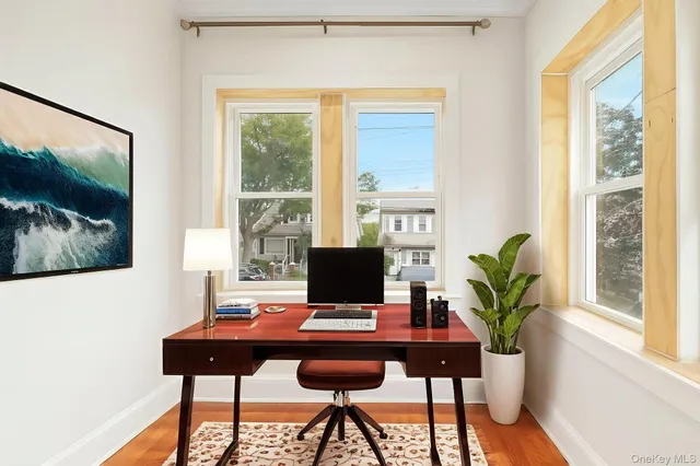 a view of a workspace with furniture