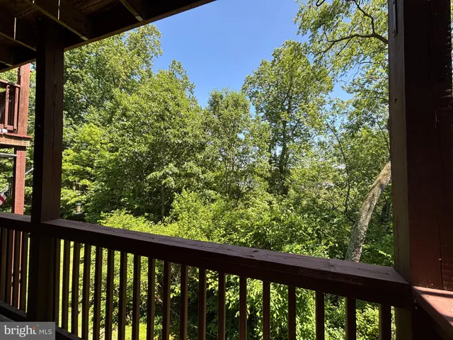 a view of a garden from a balcony