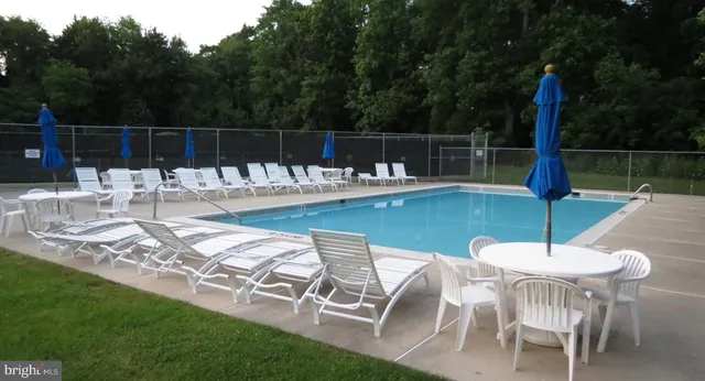 a view of a swimming pool with a patio