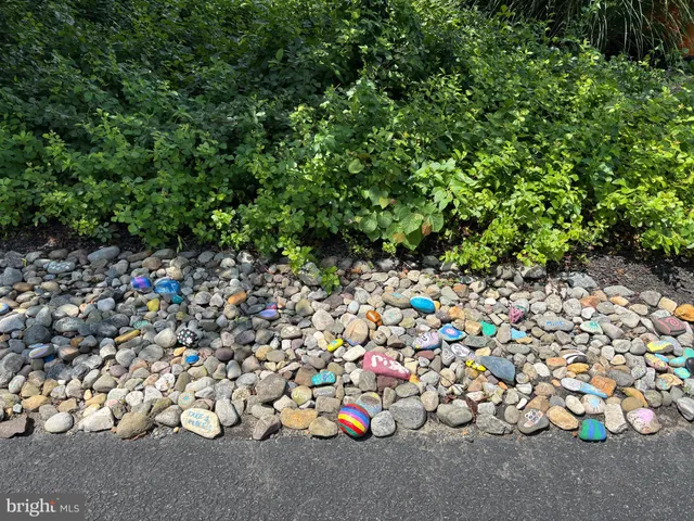a view of a house with swimming pool and yard