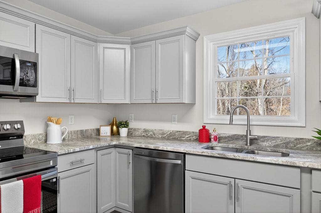 1637 A Street Waynesboro, VA 22980 - Photo 15 of 42 a kitchen with granite countertop cabinets sink and window