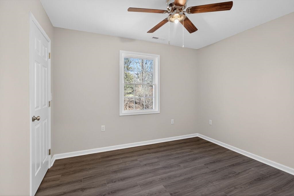 1637 A Street Waynesboro, VA 22980 - Photo 23 of 42 wooden floor in an empty room with a window