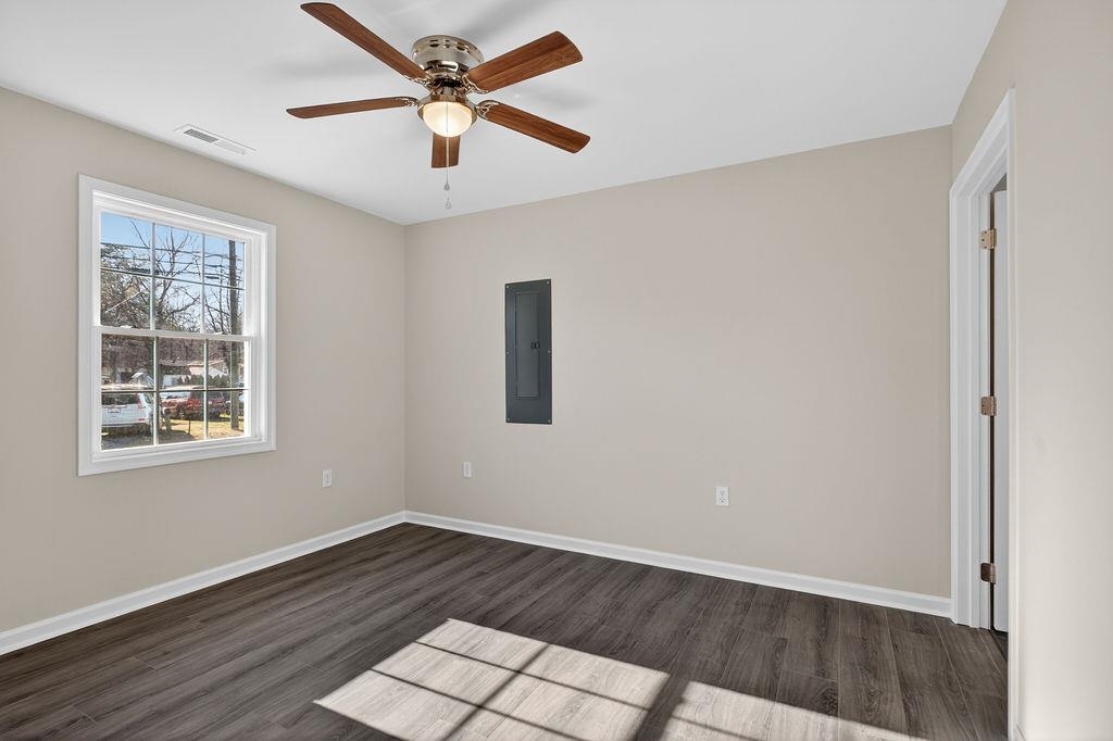 1637 A Street Waynesboro, VA 22980 - Photo 28 of 42 a view of an empty room with wooden floor and a window