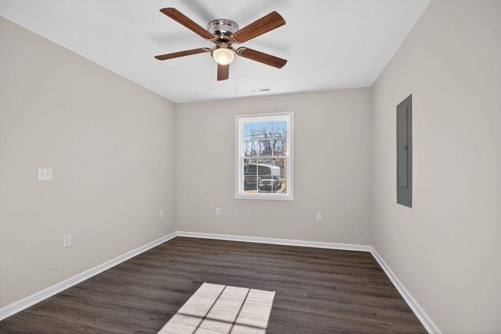 1637 A Street Waynesboro, VA 22980 - Photo 29 of 42 an empty room with wooden floor and windows