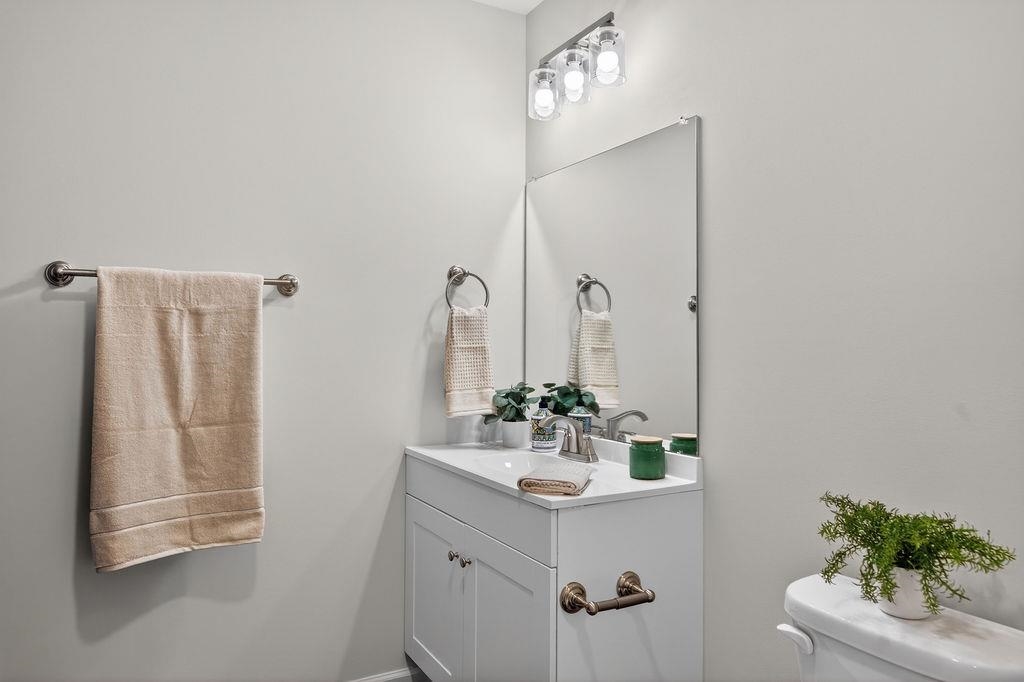 1637 A Street Waynesboro, VA 22980 - Photo 32 of 42 a bathroom with a double vanity sink and a mirror