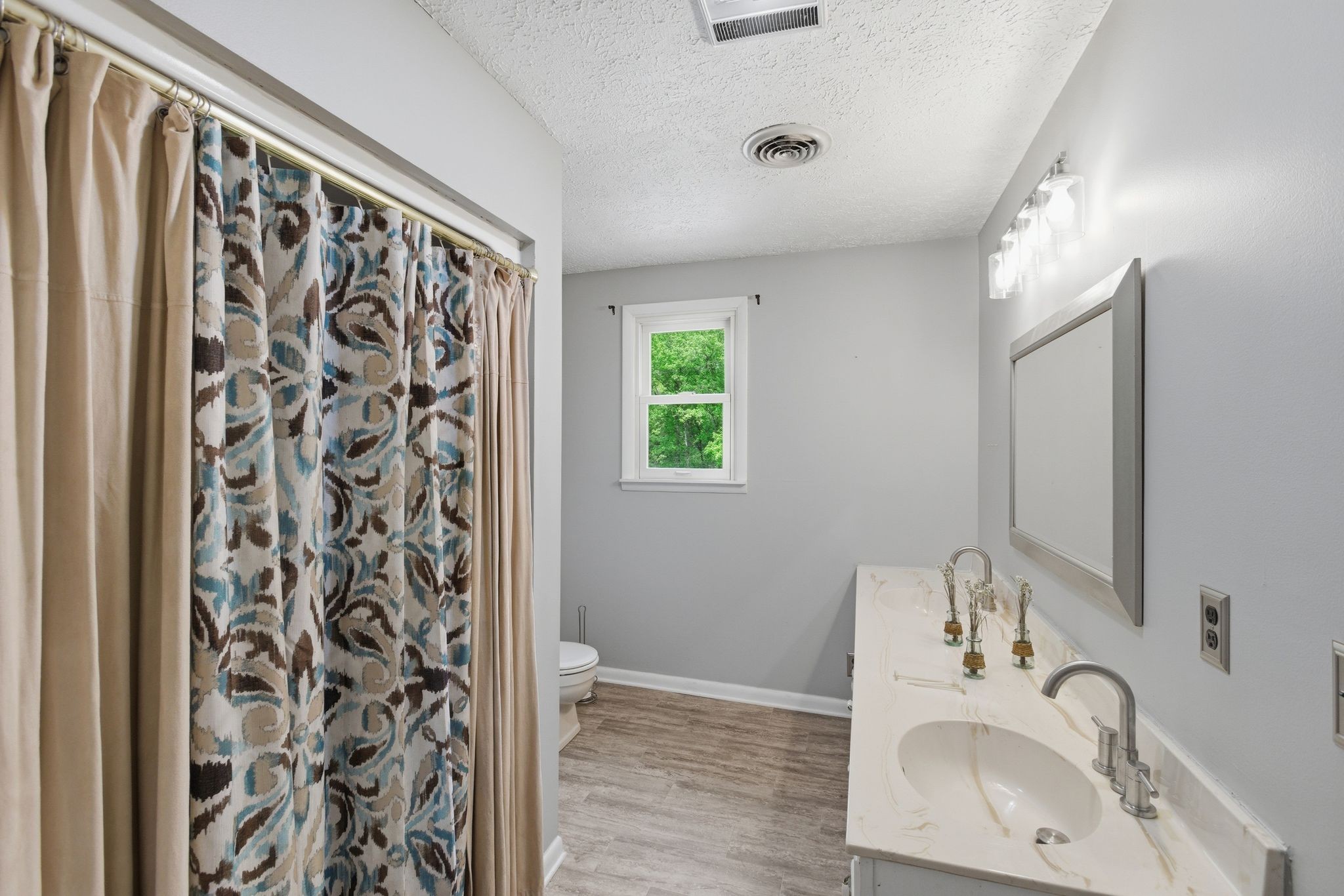 580 Defeated Creek Road Centerville, TN 37033 - Photo 41 of 71 a bathroom with a sink and a mirror