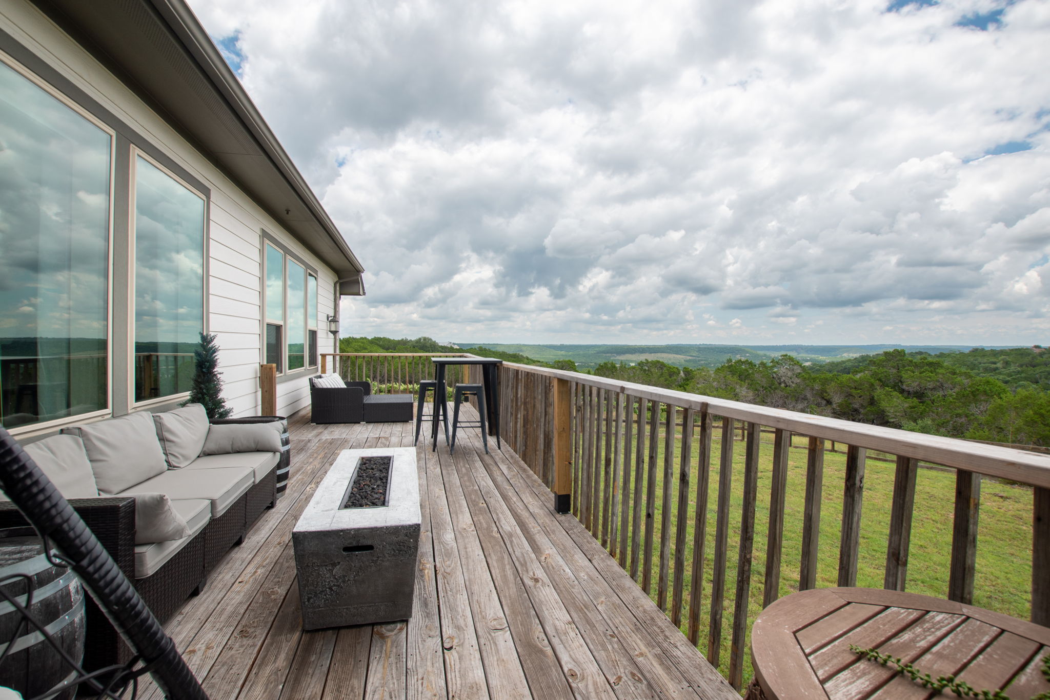 155 Balcones Ridge Way Bertram, TX 78605 - Photo 7 of 37 The spacious deck offers unhindered, panoramic views of the surrounding natural beauty.