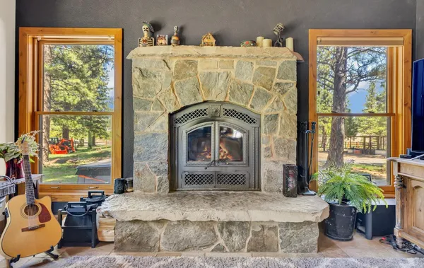 a bedroom with bed and a large window