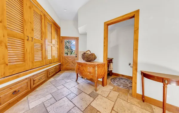 a living room with a large window and a table
