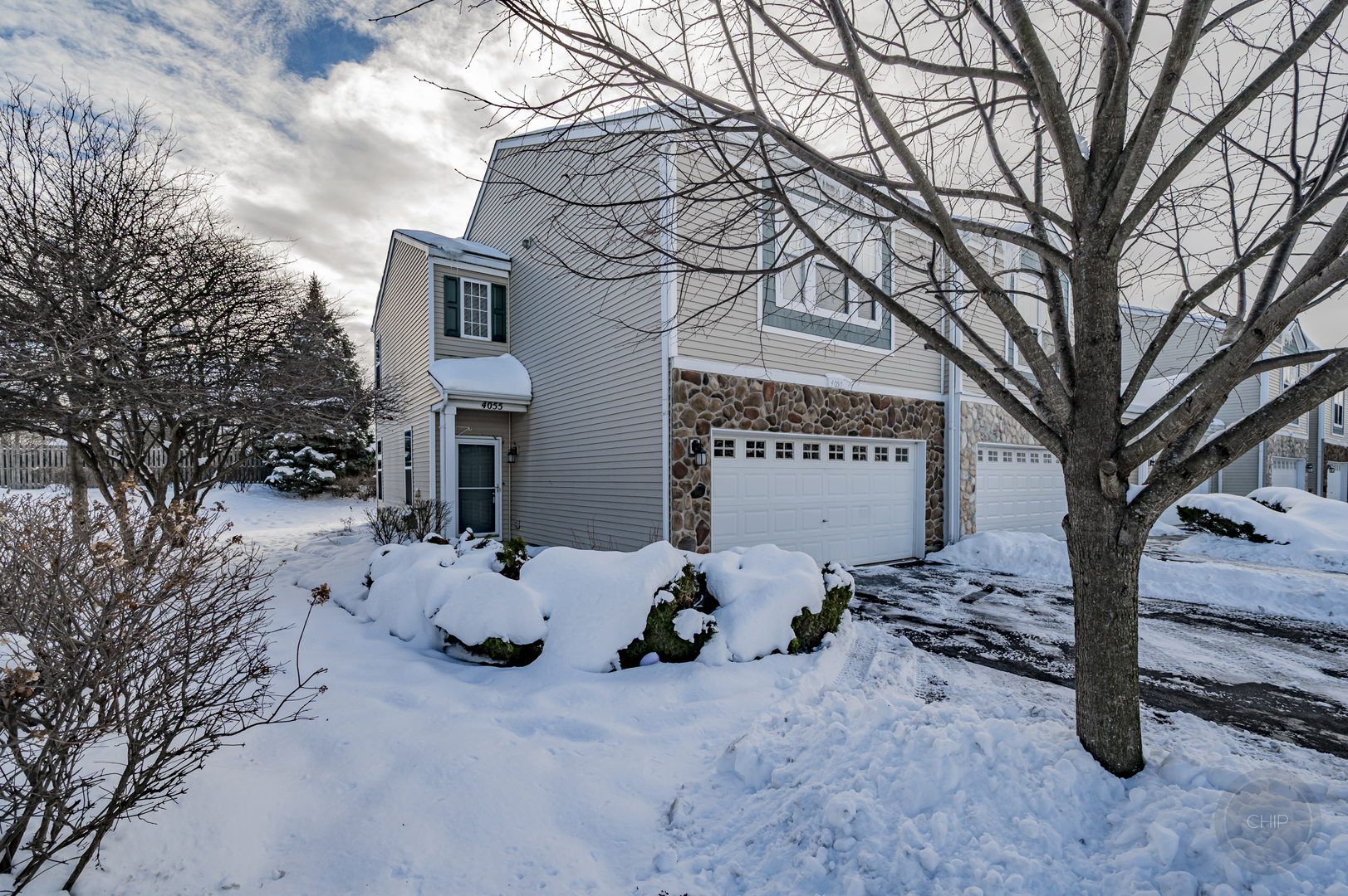 4055 Blackstone Drive, Unit 4055 Aurora, IL 60504 - Photo 1 of 43 a view of a car park in front of house