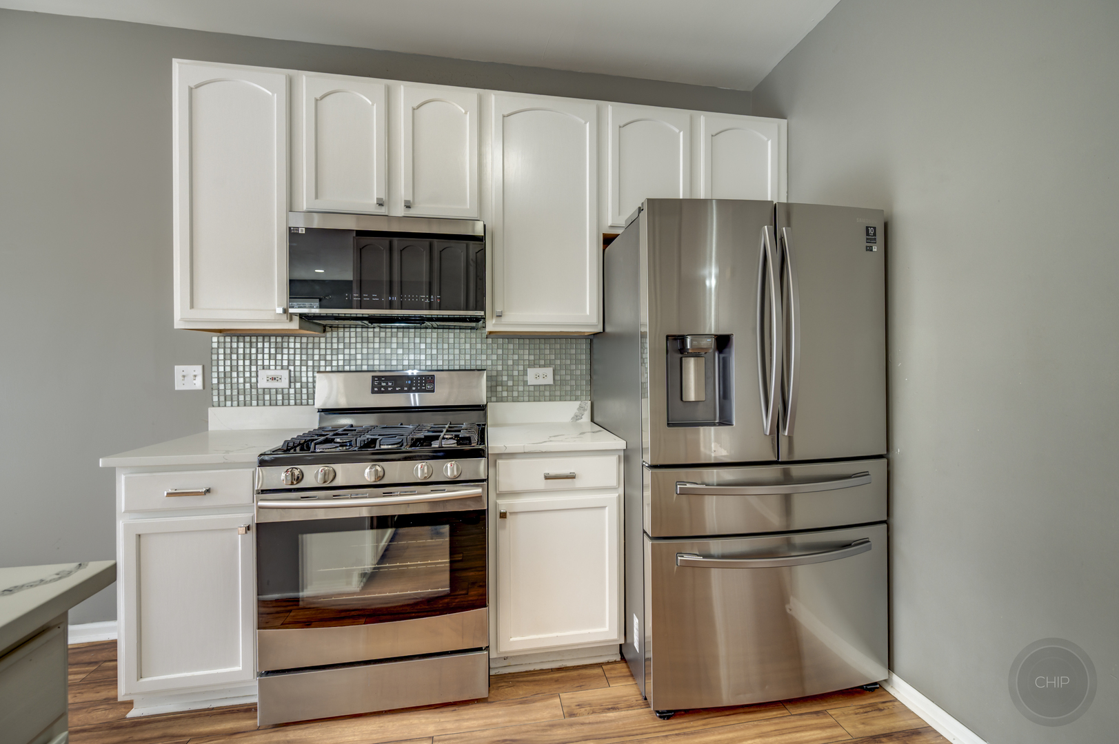 4055 Blackstone Drive, Unit 4055 Aurora, IL 60504 - Photo 13 of 43 a kitchen with appliances a sink and a stove