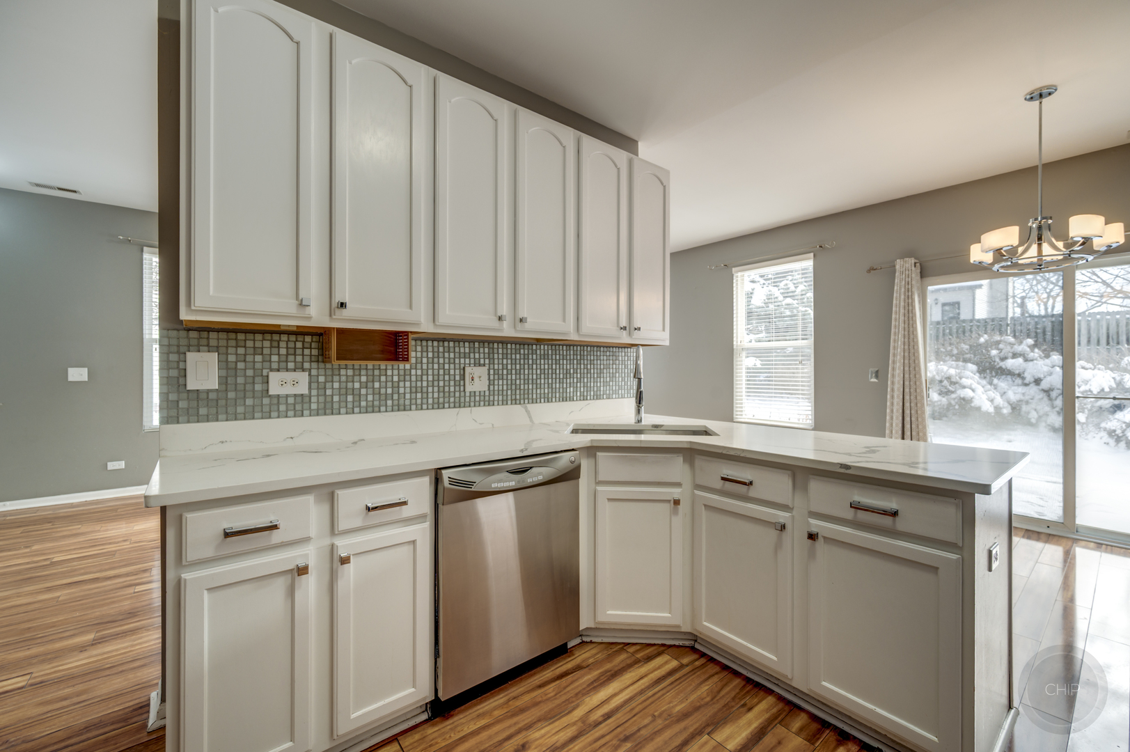 4055 Blackstone Drive, Unit 4055 Aurora, IL 60504 - Photo 14 of 43 a kitchen with granite countertop white cabinets and white appliances