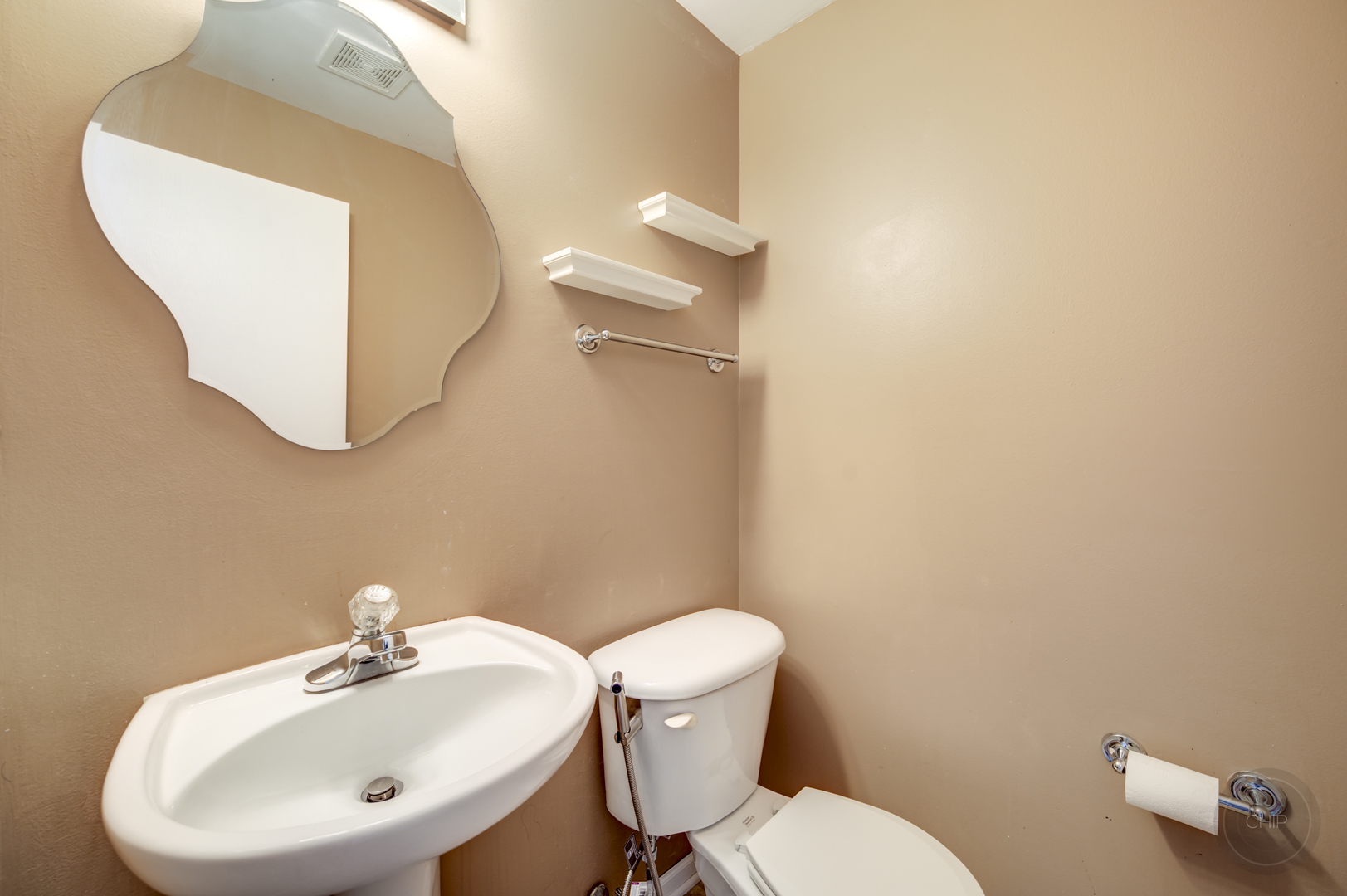4055 Blackstone Drive, Unit 4055 Aurora, IL 60504 - Photo 17 of 43 a bathroom with a toilet sink and mirror