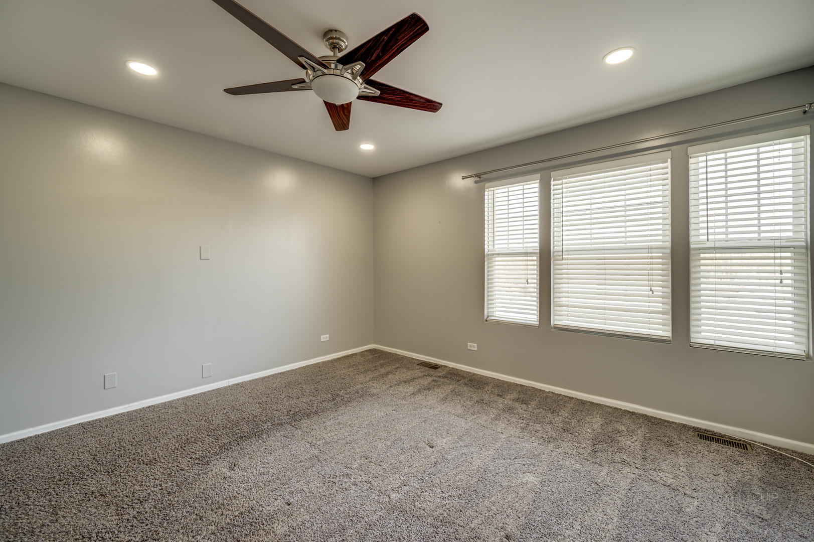 4055 Blackstone Drive, Unit 4055 Aurora, IL 60504 - Photo 21 of 43 a view of an empty room with a window