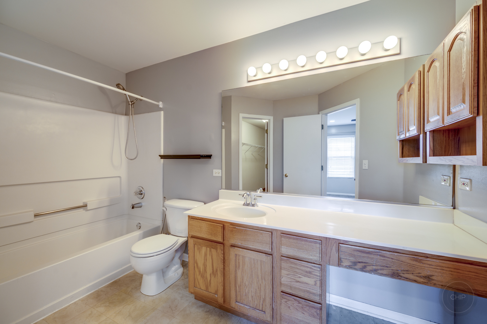 4055 Blackstone Drive, Unit 4055 Aurora, IL 60504 - Photo 22 of 43 a bathroom with a sink a toilet and a mirror