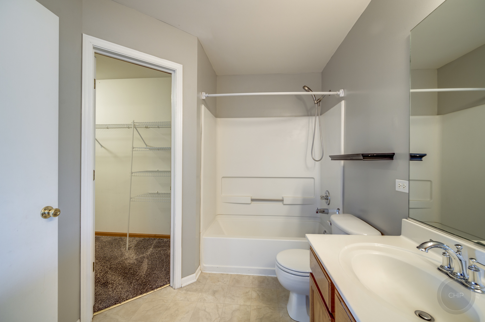 4055 Blackstone Drive, Unit 4055 Aurora, IL 60504 - Photo 23 of 43 a bathroom with a sink a toilet and shower