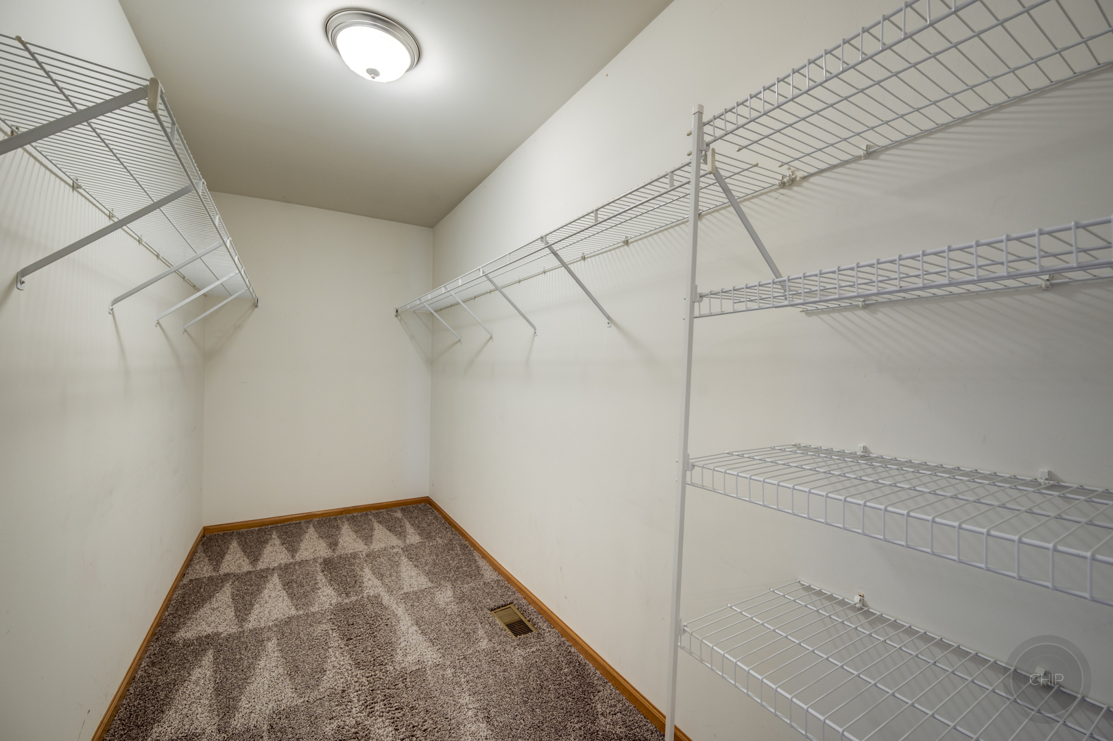 4055 Blackstone Drive, Unit 4055 Aurora, IL 60504 - Photo 24 of 43 a view of a room with racks on the wall
