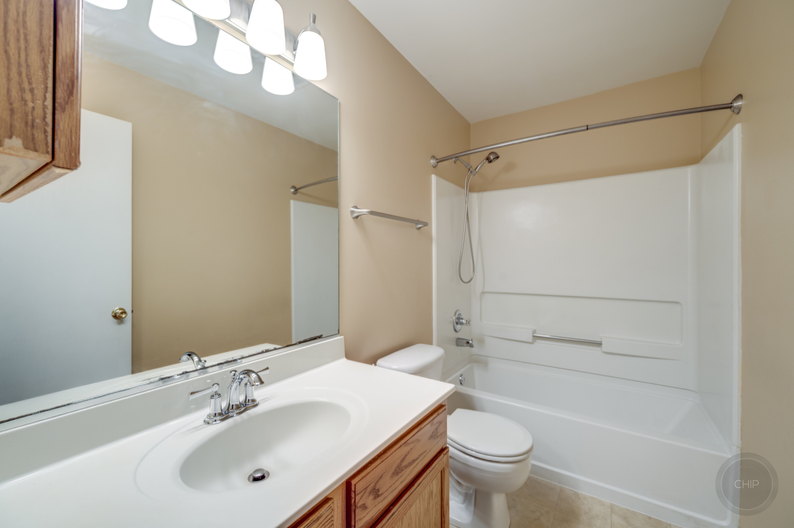 4055 Blackstone Drive, Unit 4055 Aurora, IL 60504 - Photo 27 of 43 a bathroom with a sink a toilet and shower