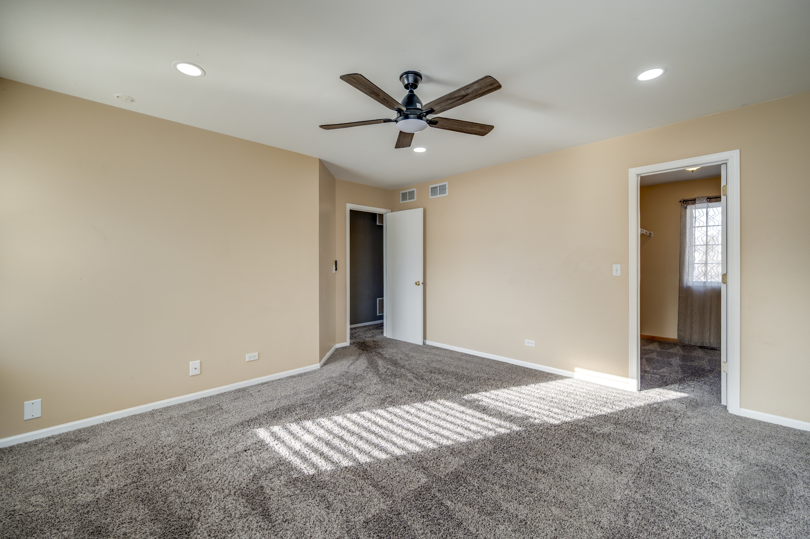 4055 Blackstone Drive, Unit 4055 Aurora, IL 60504 - Photo 34 of 43 a view of a livingroom with a ceiling fan and window