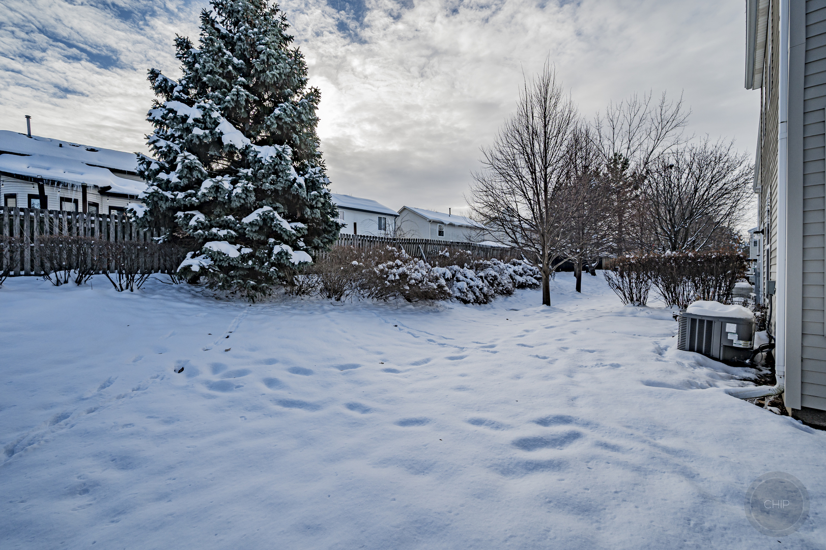 4055 Blackstone Drive, Unit 4055 Aurora, IL 60504 - Photo 37 of 43 a view of a yard covered with snow in the background