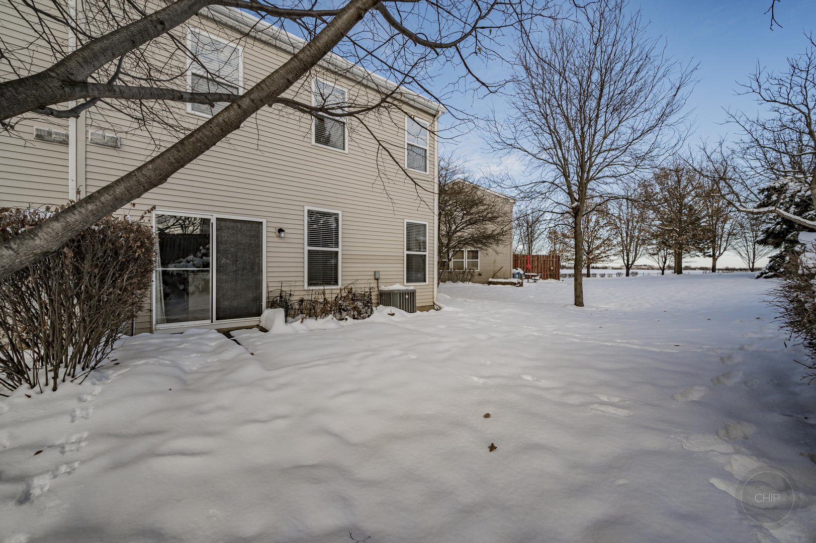 4055 Blackstone Drive, Unit 4055 Aurora, IL 60504 - Photo 41 of 43 a view of a house with snow on the road