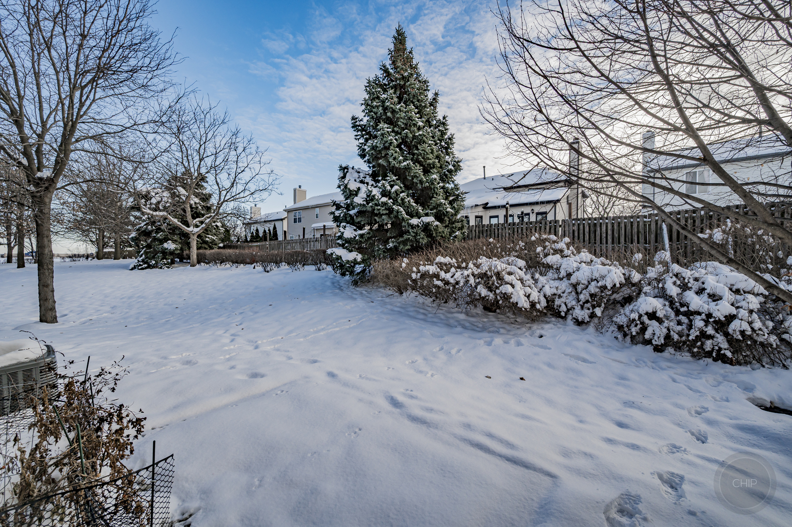 4055 Blackstone Drive, Unit 4055 Aurora, IL 60504 - Photo 42 of 43 a view of a yard covered in snow