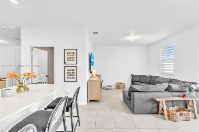 a living room with furniture and a table