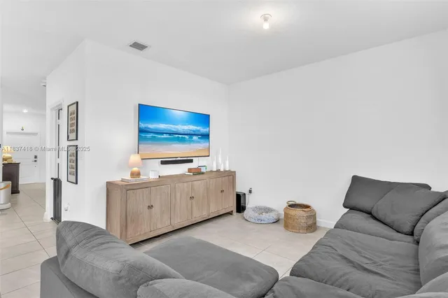 a living room with furniture and window