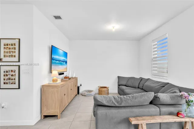 a living room with furniture and a couch
