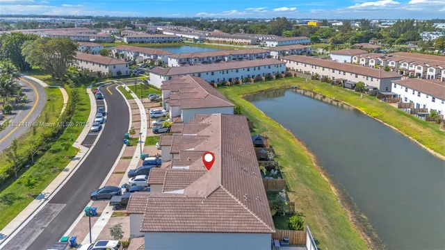 an aerial view of a house with a swimming pool