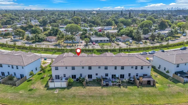 an aerial view of a house with a ocean view