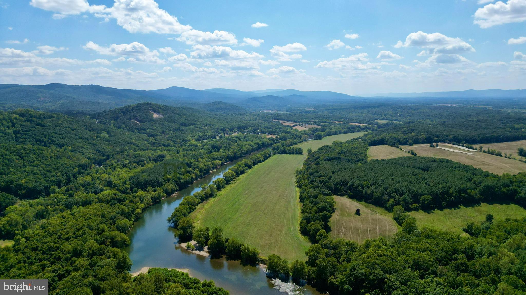 230 Spring Hollow Road Front Royal, VA 22630 - Photo 15 of 37 an aerial view of green landscape with trees houses and mountain view