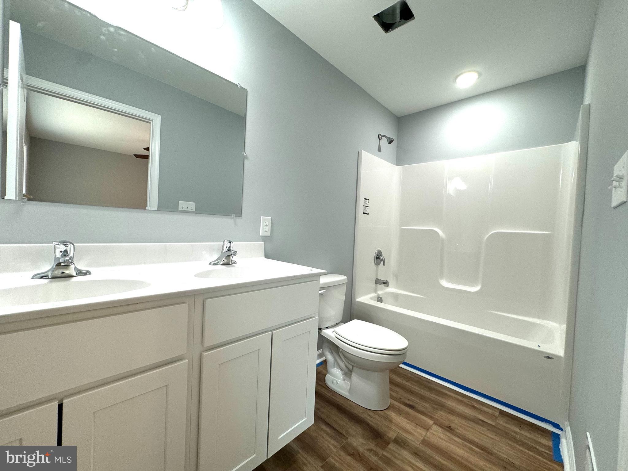 230 Spring Hollow Road Front Royal, VA 22630 - Photo 8 of 37 a bathroom with a sink a toilet and shower