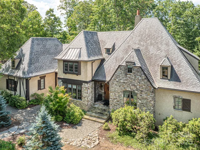 a aerial view of a house with a yard