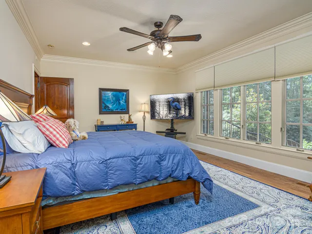 a living room with furniture and a floor to ceiling window