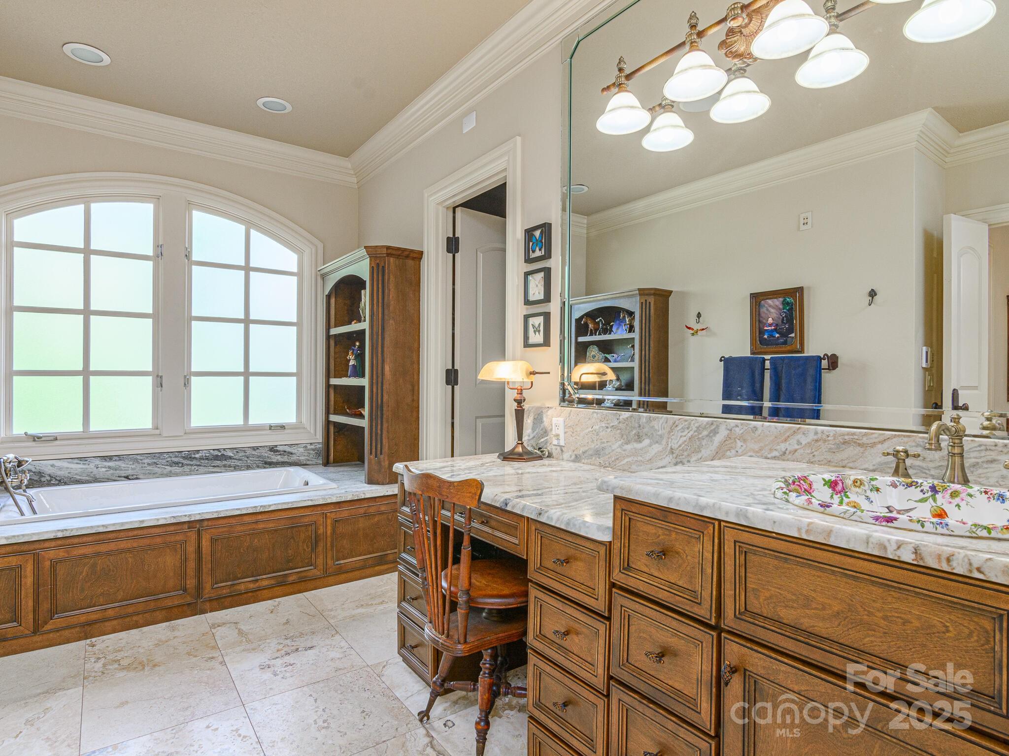 176 Valley Springs Road Asheville, NC 28803 - Photo 18 of 48 a spacious bathroom with a granite countertop sink a large mirror and a bathtub