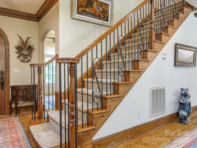 a aerial view of a house with a yard and potted plants