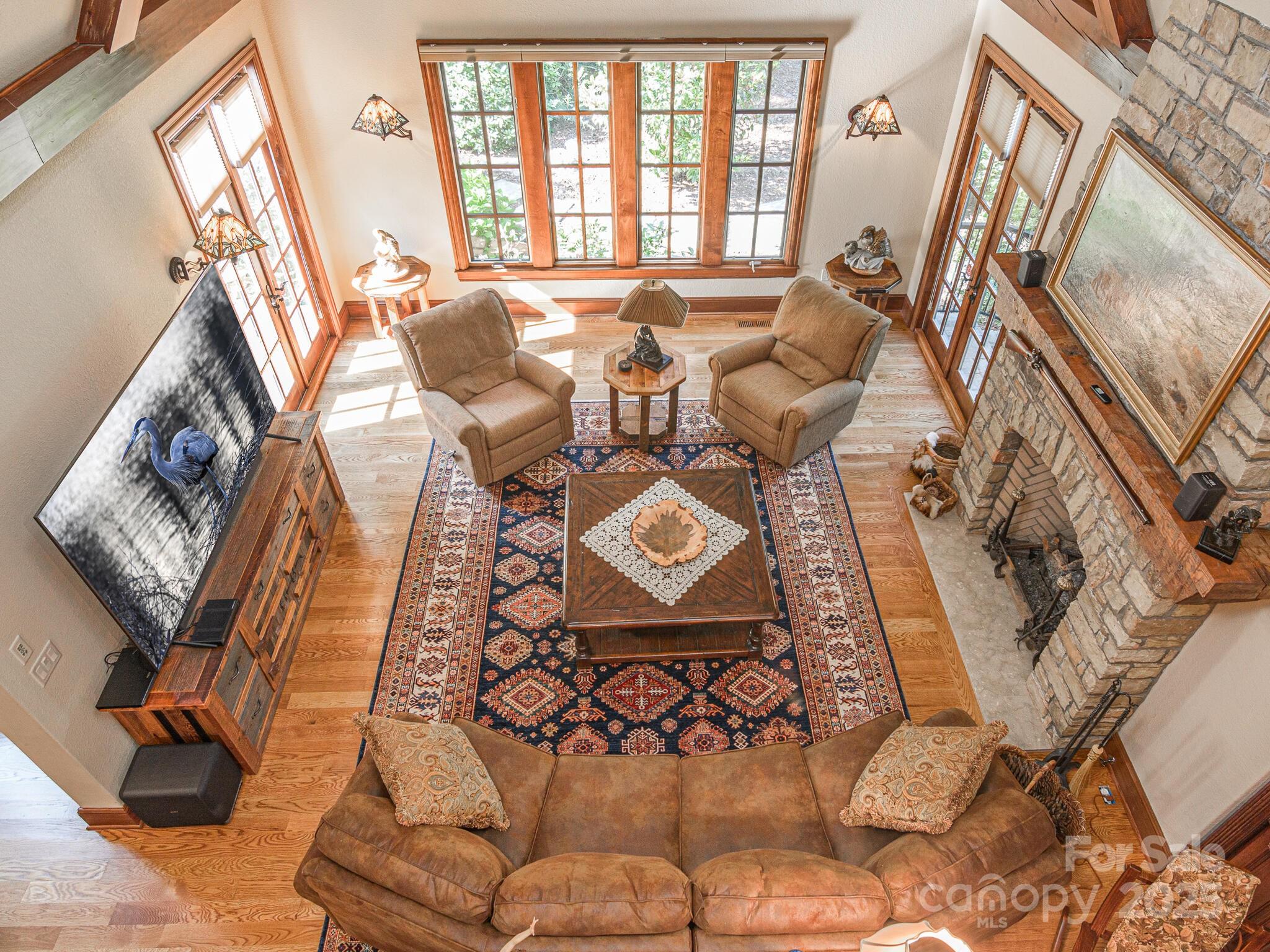 176 Valley Springs Road Asheville, NC 28803 - Photo 23 of 48 a living room with furniture and a floor to ceiling window