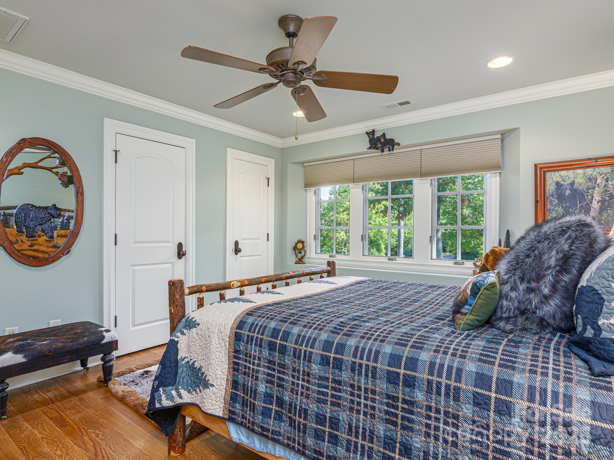 176 Valley Springs Road Asheville, NC 28803 - Photo 26 of 48 a bedroom with a bed and a window
