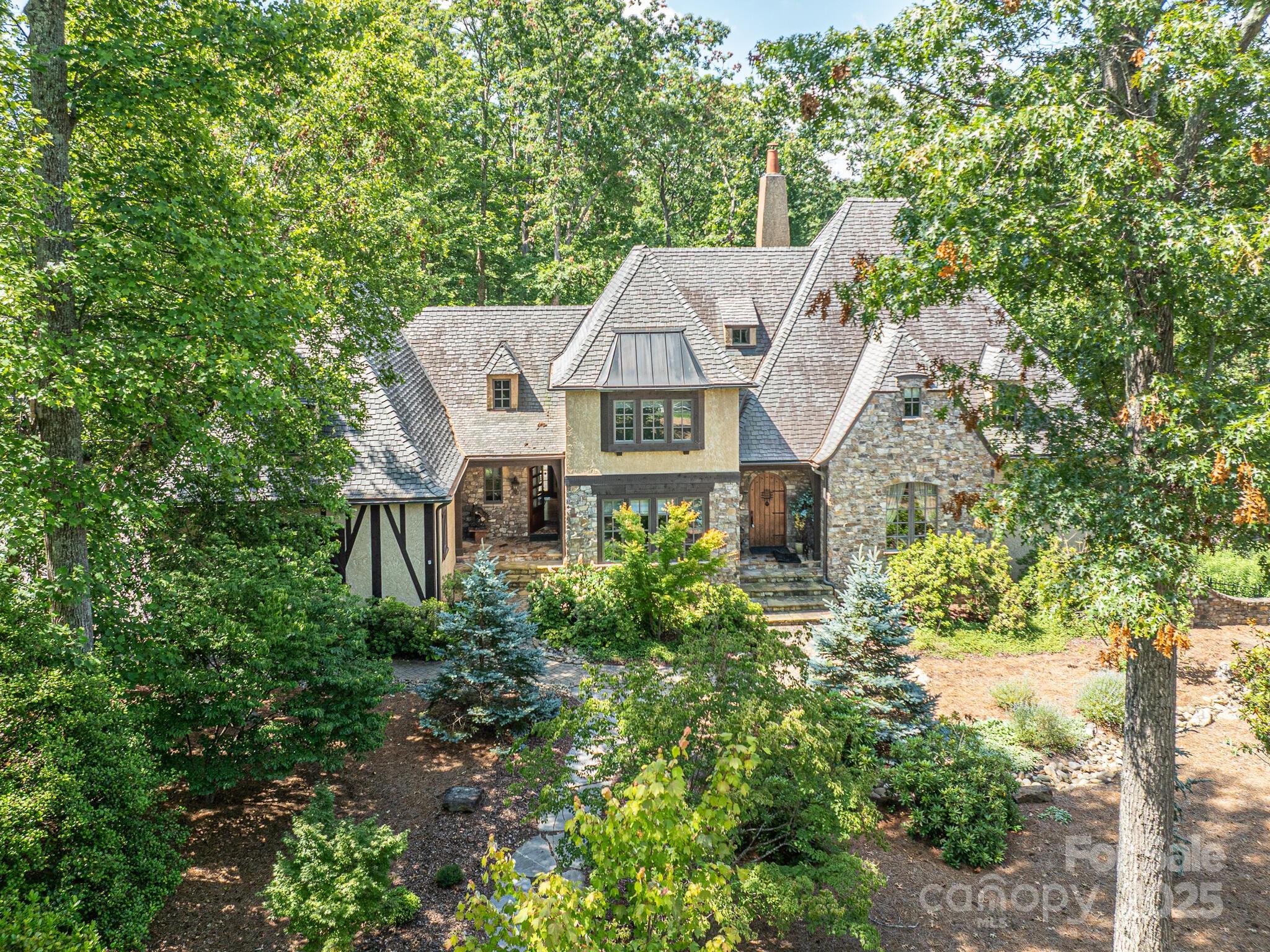 176 Valley Springs Road Asheville, NC 28803 - Photo 36 of 48 a aerial view of a house with a yard and potted plants